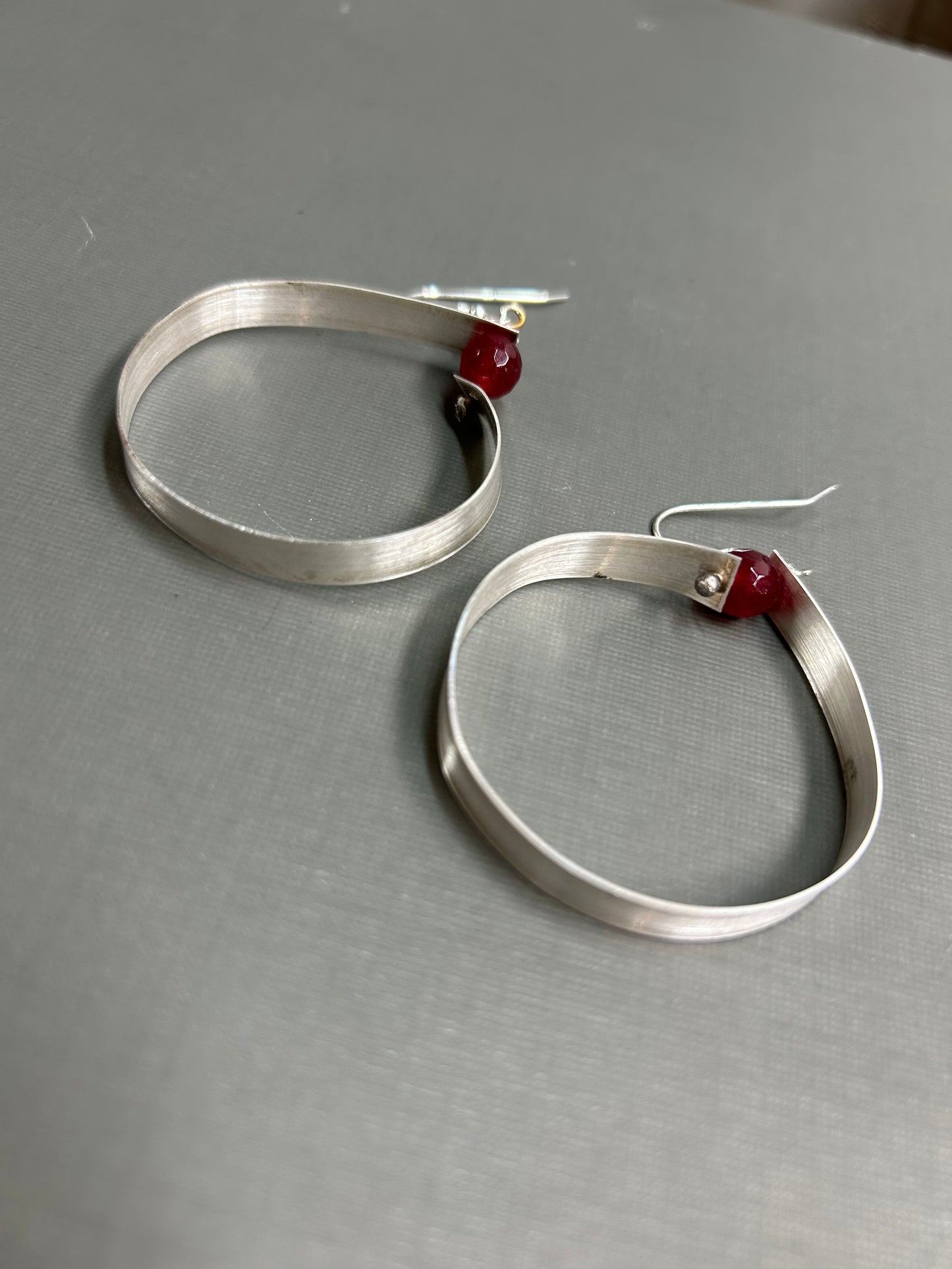 Wide silver hoops with gemstone