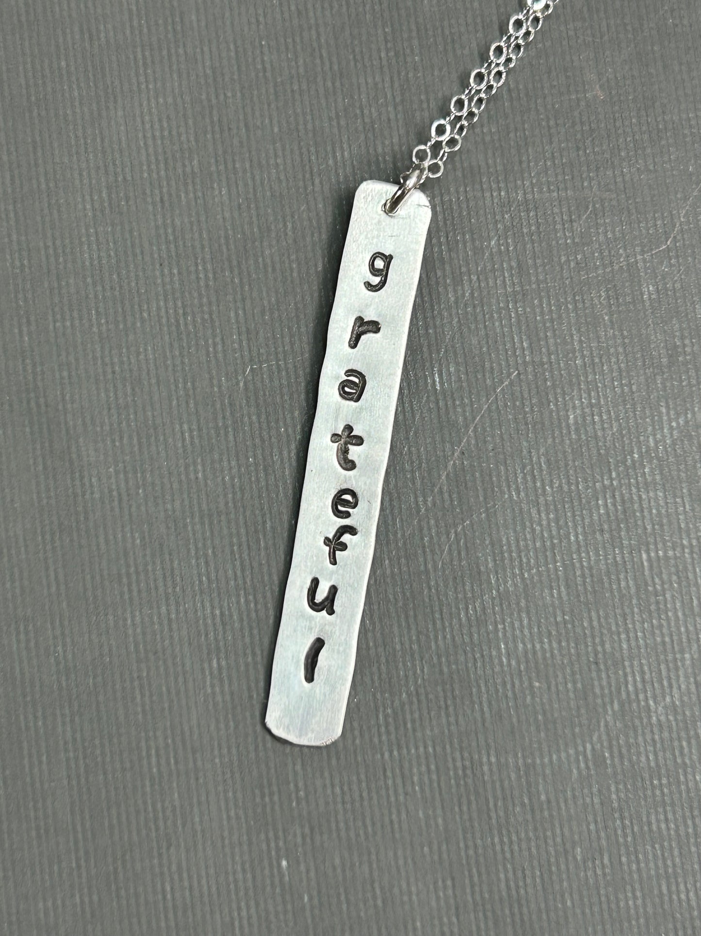 Grateful- stamped silver necklace