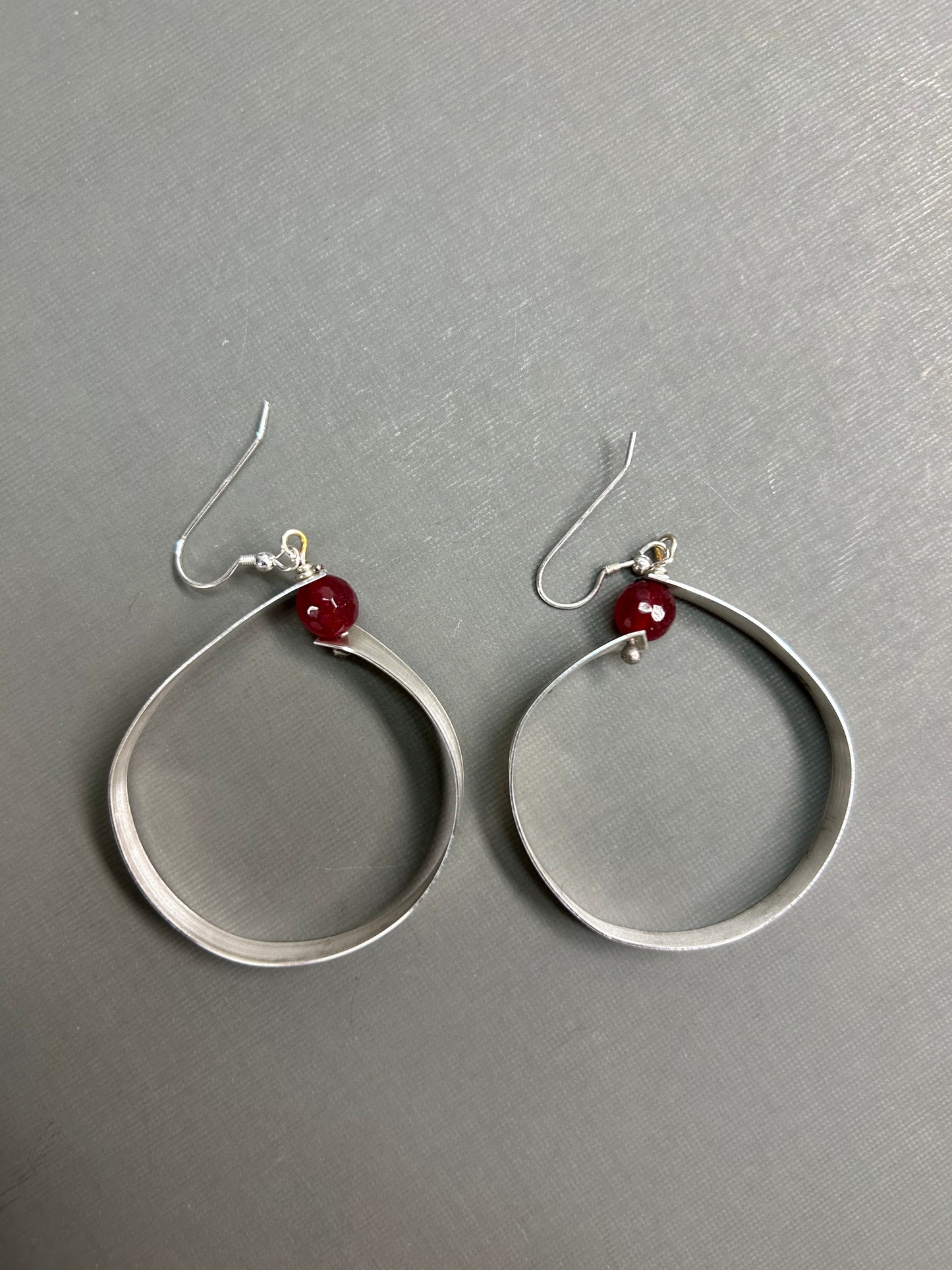 Wide silver hoops with gemstone
