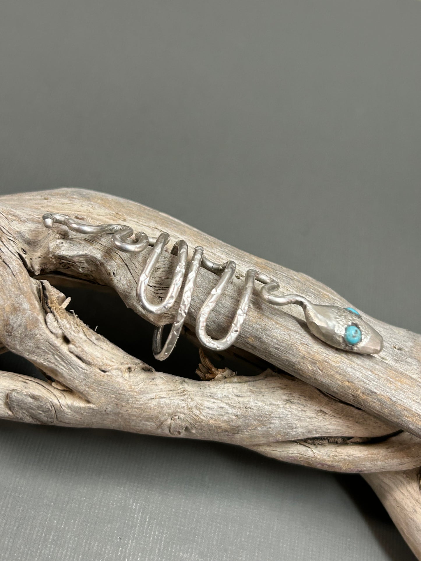 Snake ring wiggly silver snake with turquoise eyes