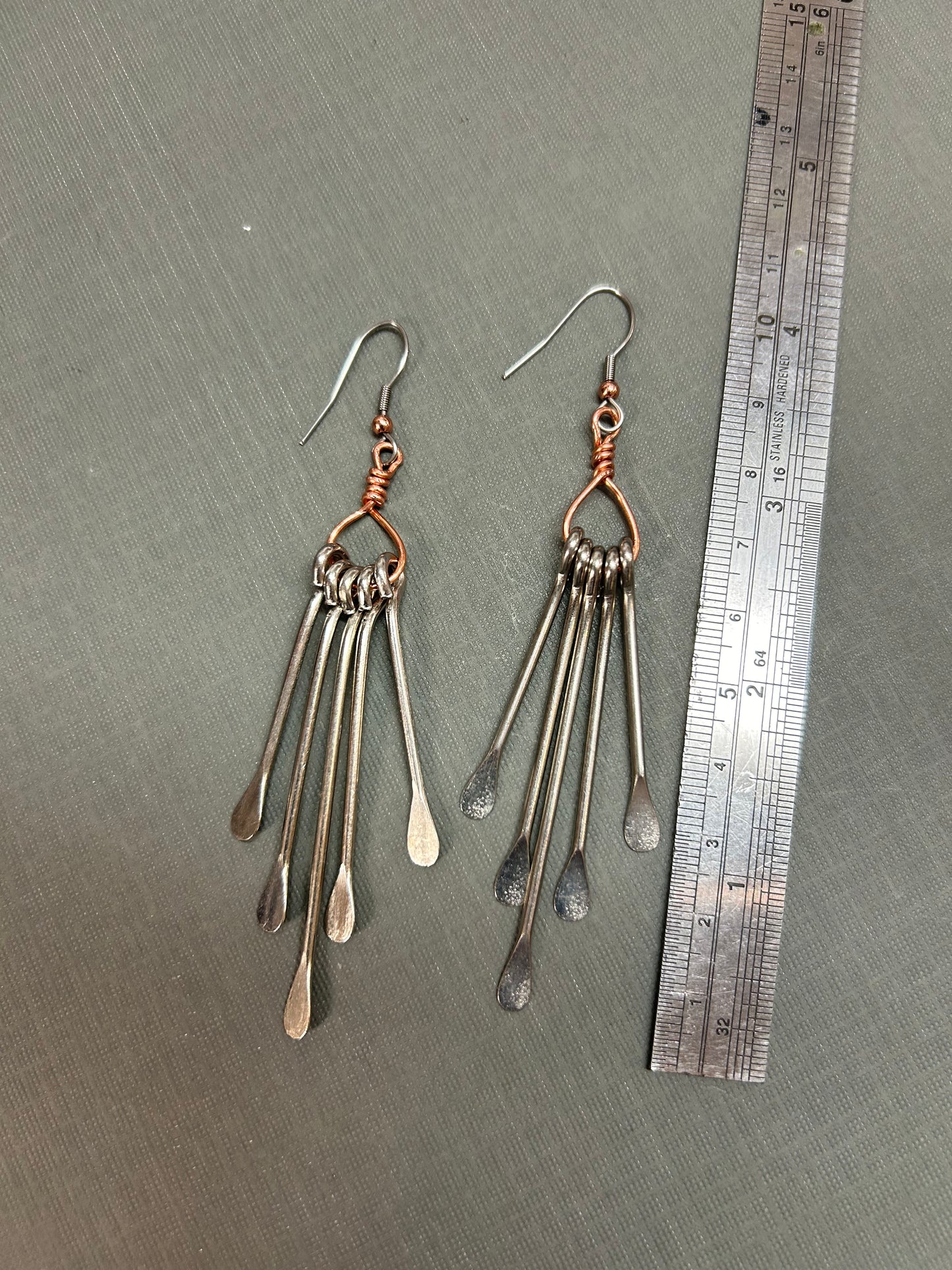Long pedal dangle earrings