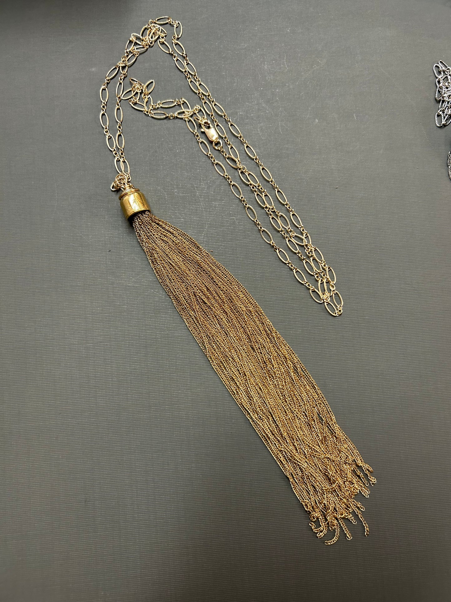 Tassel gold neck