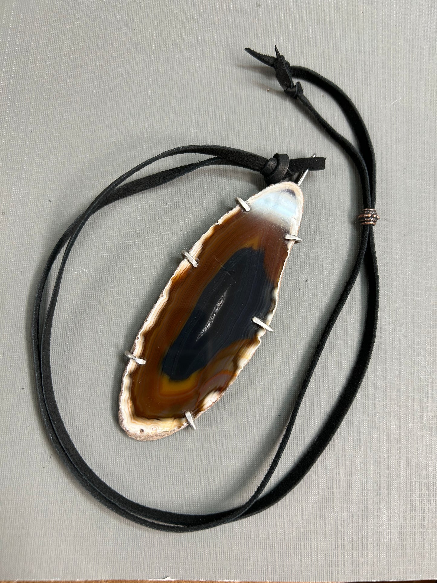 Agate gemstone on leather