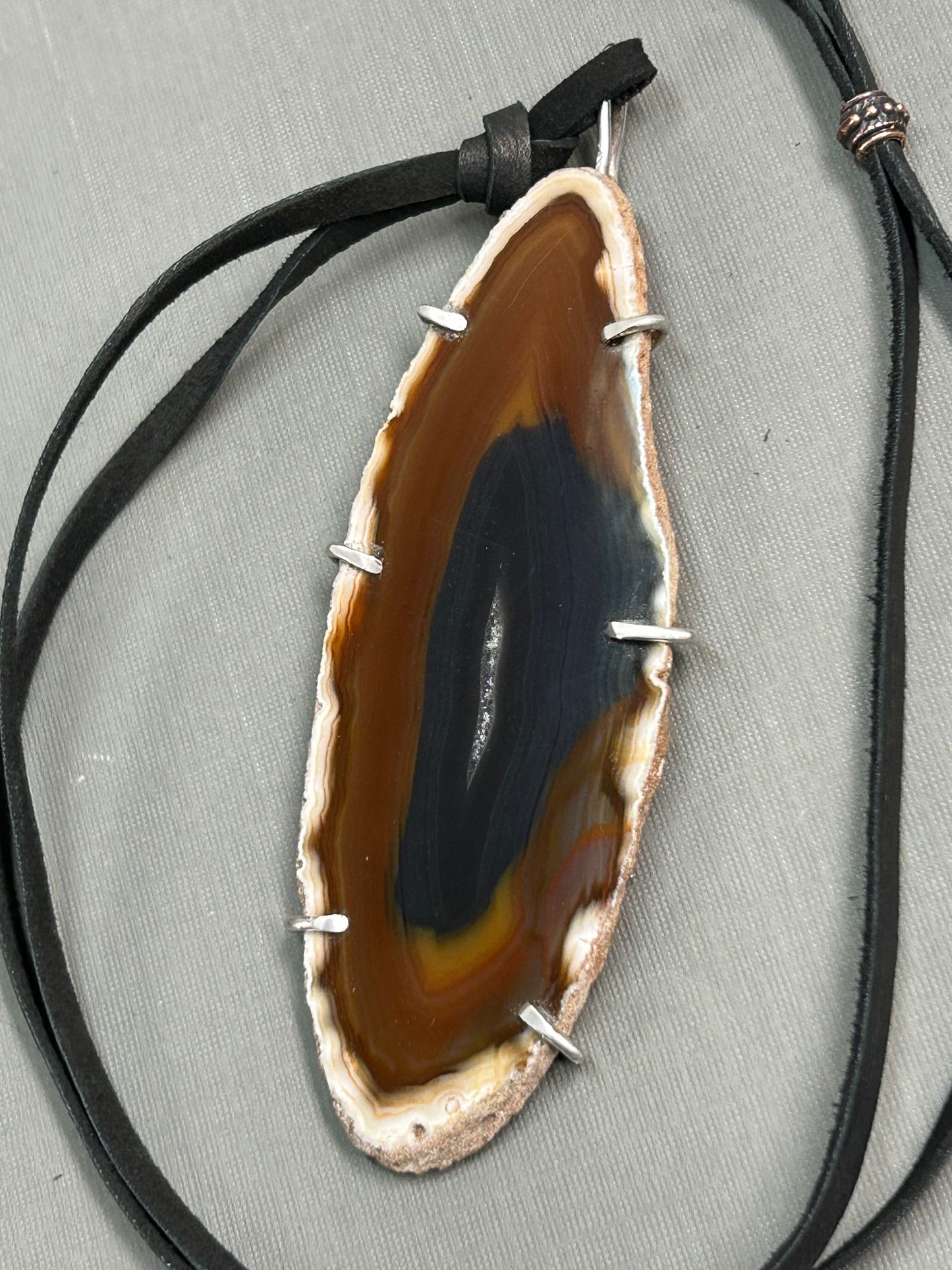 Agate gemstone on leather
