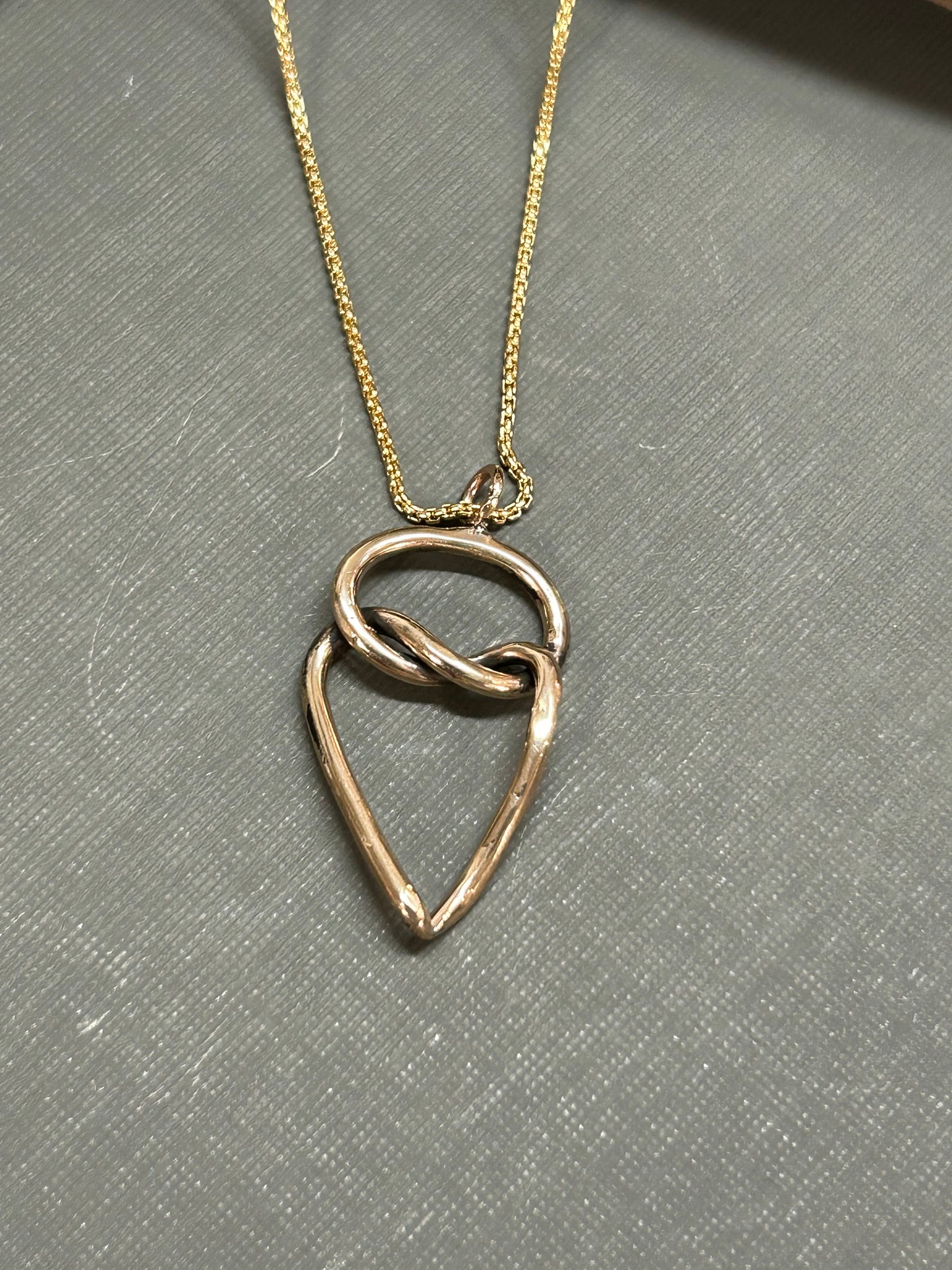 Heart and knot gold necklace