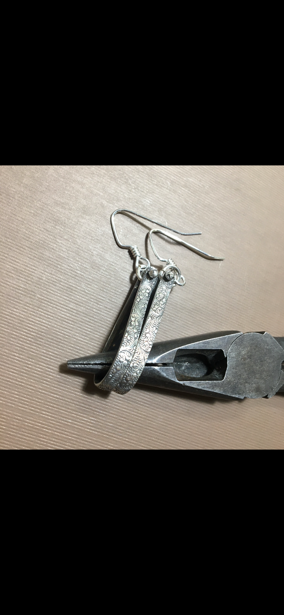 Long hoop textured earrings