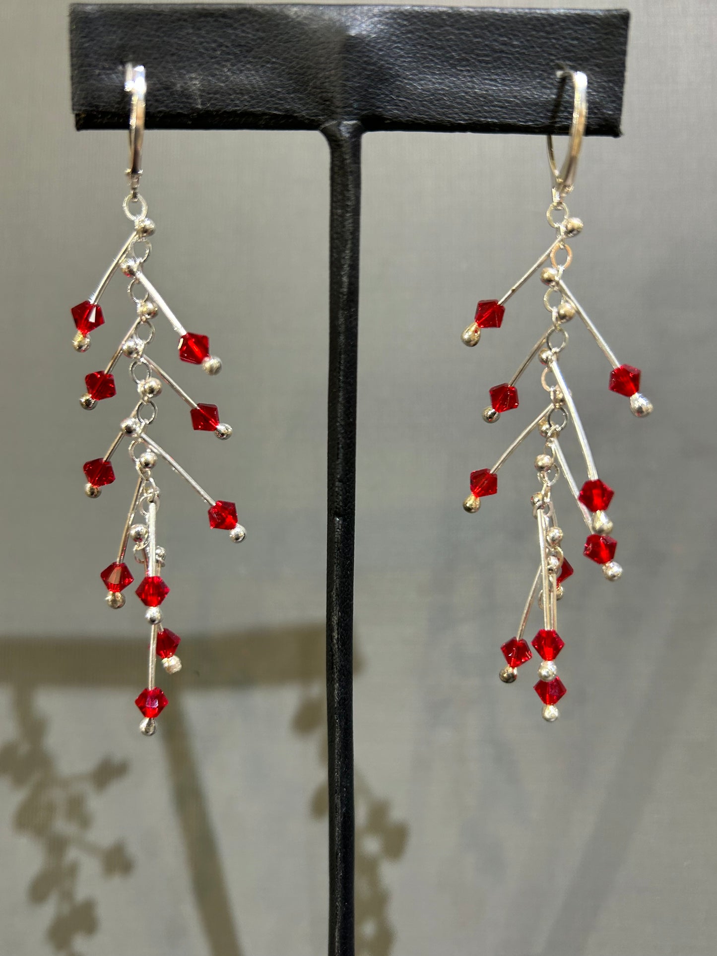 Kinetic earrings silver and red crystals