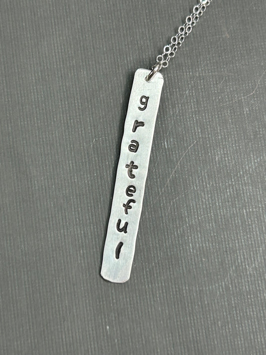 Grateful- stamped silver necklace
