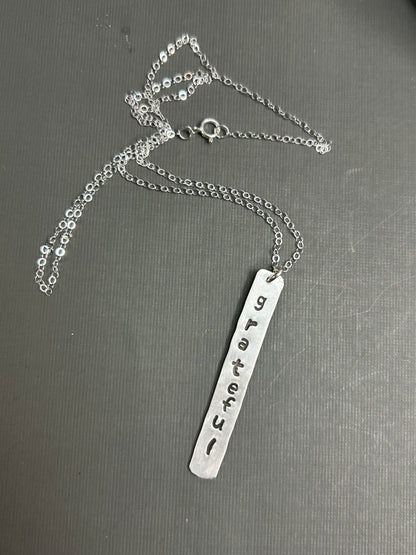 Grateful- stamped silver necklace