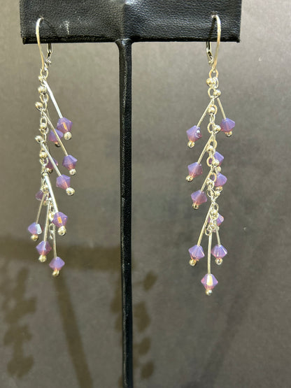 Kinetic earrings silver and purple crystals.