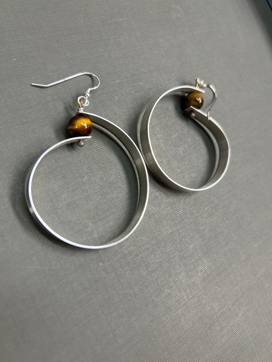 Wide silver hoops and gemstone earrings