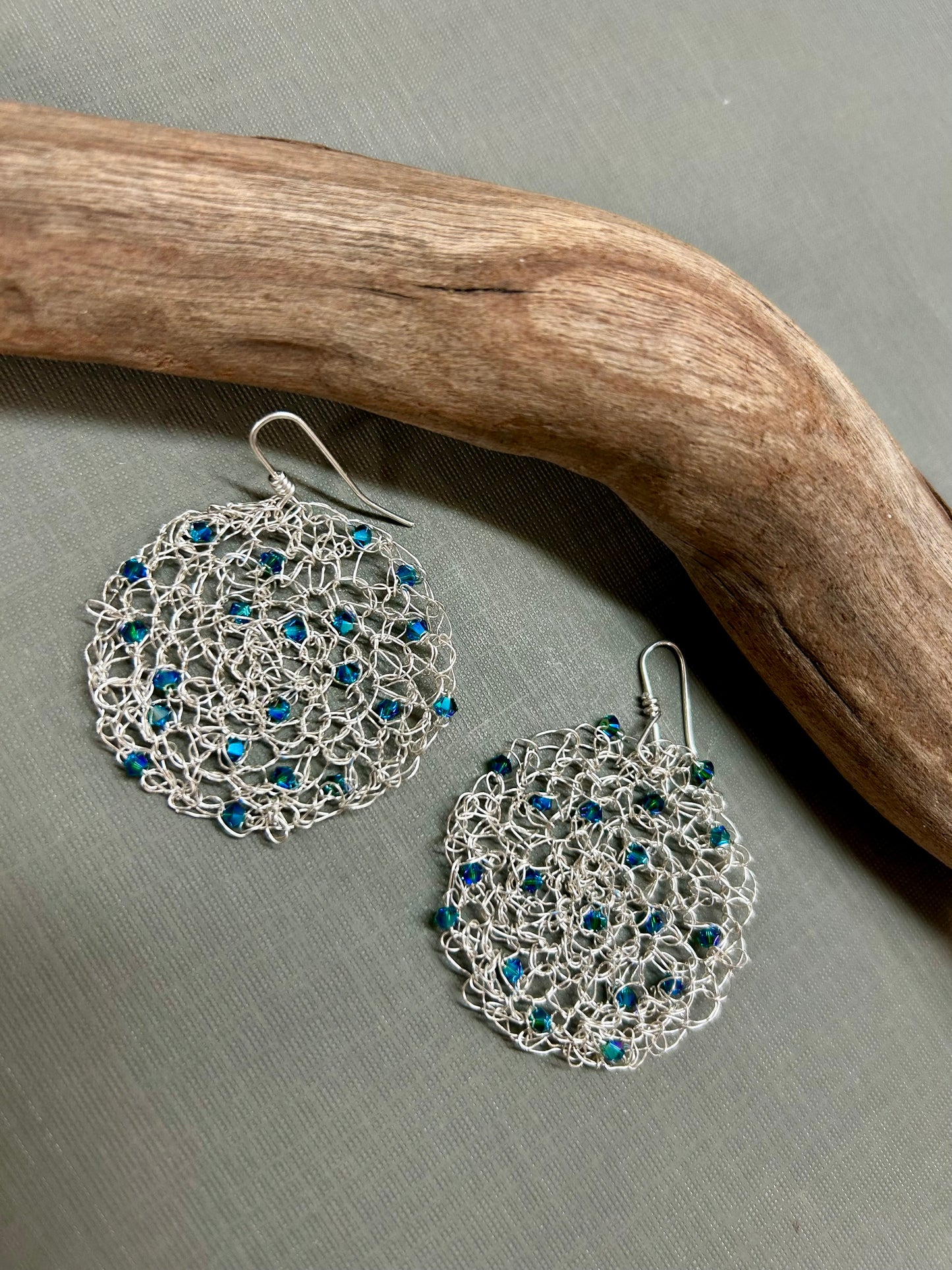 Crochet circle earrings with blue crystals