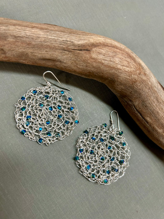 Crochet circle earrings with blue crystals