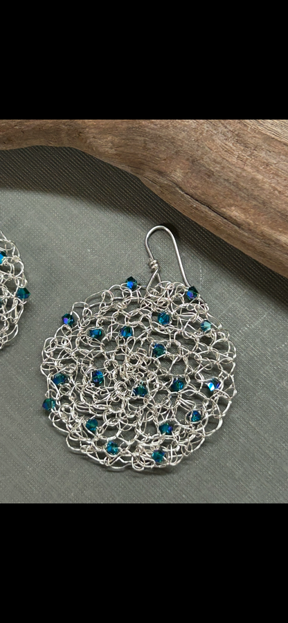Crochet circle earrings with blue crystals