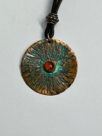 Copper  and carnelian pendant on leather
