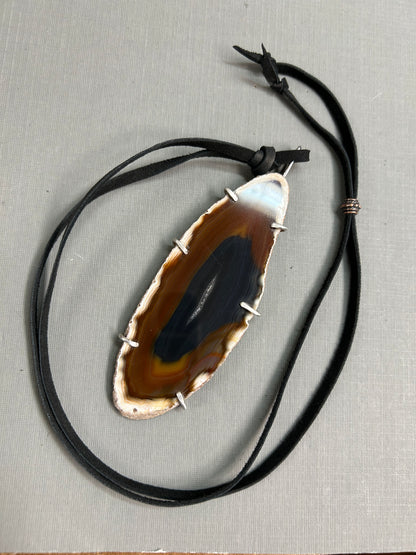 Agate gemstone on leather